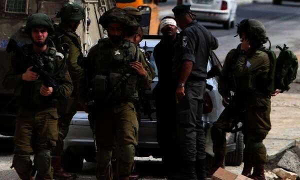 الاحتلال يعتقل 14 فلسطينيا من الضفة